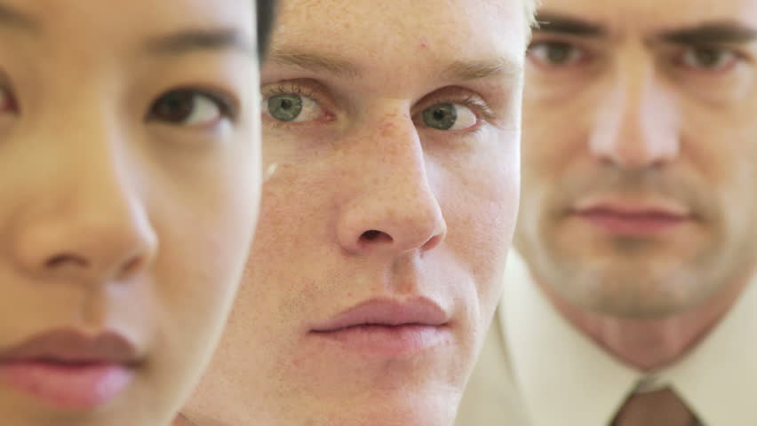 Closeup face portrait of three young business colleagues