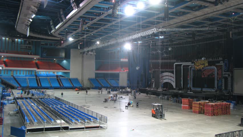 MOSCOW - DEC 17: (Timelapse View) Sceneshifters demount scenery after concert of Legend RetroFM in Sports complex Olimpiyskiy, on Dec 17, 2011 in Moscow, Russia 