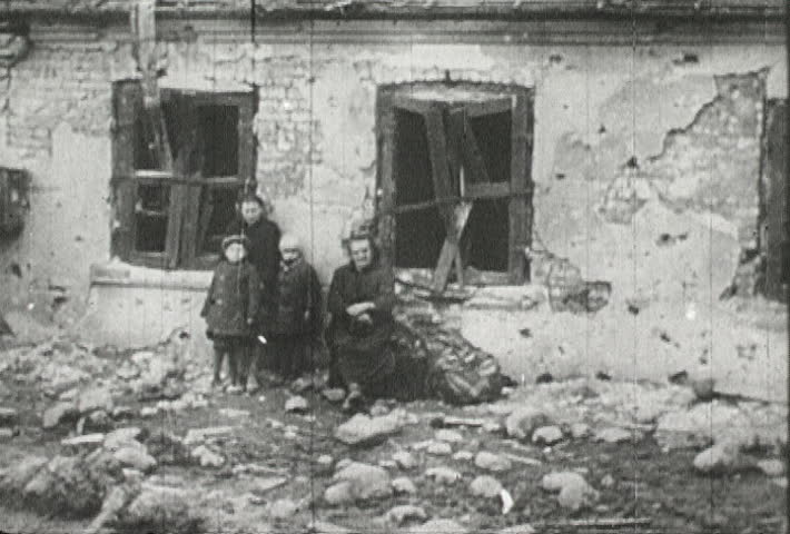 EUROPE - CIRCA 1942-1944: World War II, Misplaced People Stand Around in Bombed City
