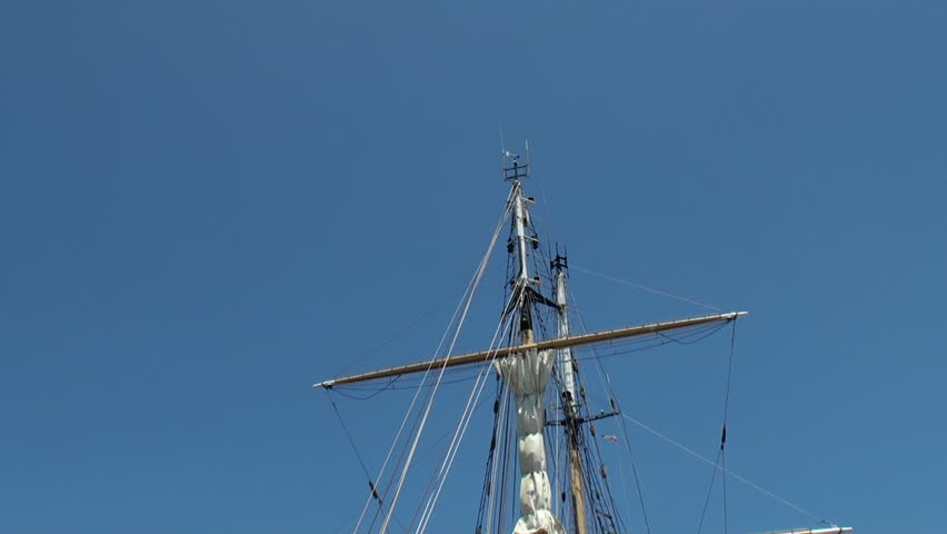 Beautiful two-masted sailing ship anchored in Papeete harbor, Tahiti, French Polynesia