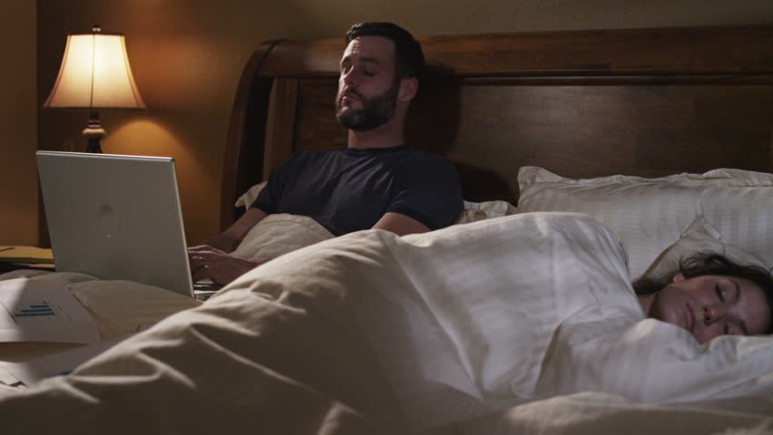 A couple balancing home life and professional life. Authentic moments around the house are captured as the couple gets ready for the day, completes work on the computer.
