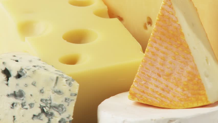 Pieces of different cheeses on plate