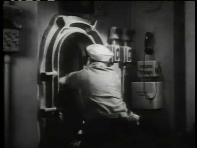 Sailor closing submarine door