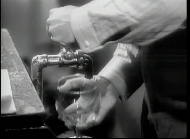 Close-up of bartender pouring draft beer