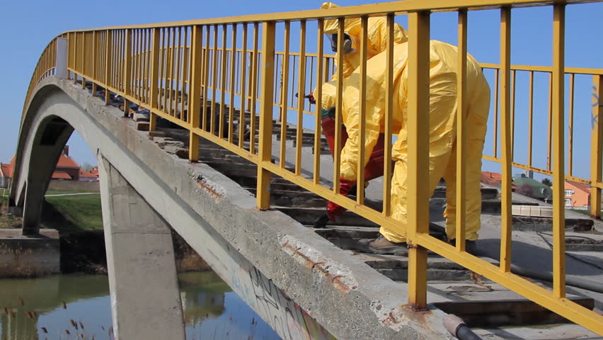 Professional  people in protective uniform removing of chemicals and dangerous materials