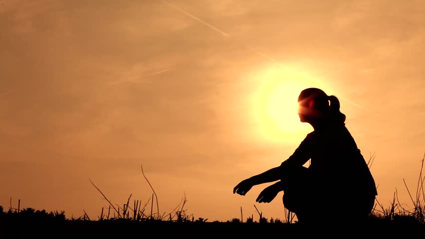 mom hugging her son silhouetted