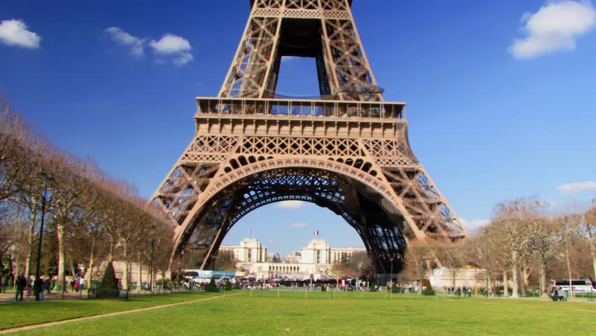 Wide shot, PAN up on Eiffel Tower, Paris, France