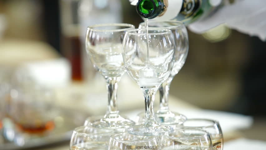 The waiter serving champagne at the reception