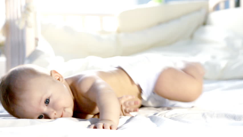 Happy baby on the bed