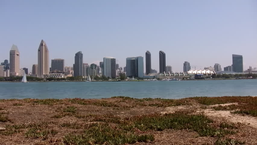 San Diego Skyline Pan Left (HD). Beautiful Skyline panorama of San Diego California. Shot with a pan motion fluid head. All logos and building legends have been removed.
