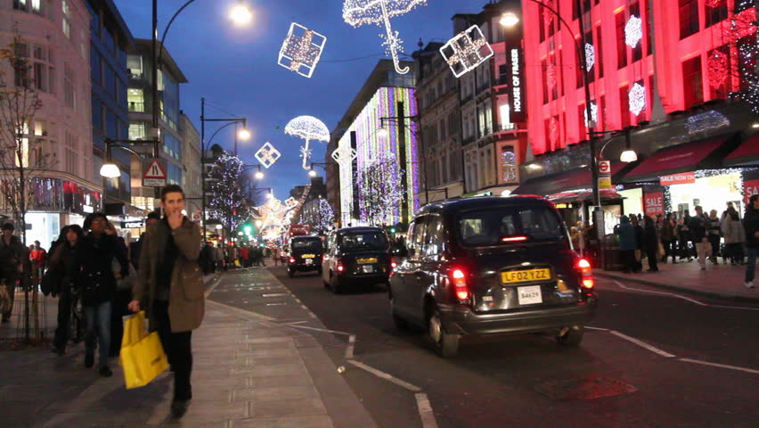 LONDON, UK - DECEMBER 27: Busses and other traffic drive beneath Christmas lights on Oxford Street on December 27, 2011 in London, UK. Oxford Street is one of the main shopping streets of London.