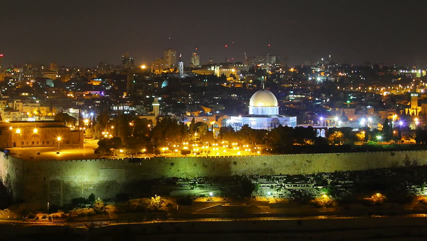 Skyline of Jerusalem Israel Dome of the Rock at night time lapse pan
