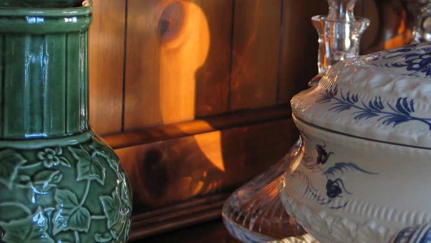 Time lapse of sunlight moving over glass and porcelain