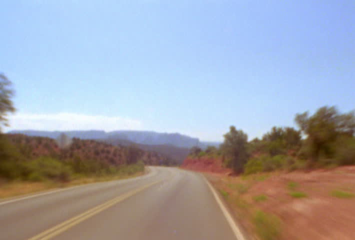 Driving down winding road
