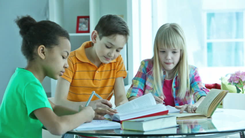 Group of pupils studying together at the after-school club