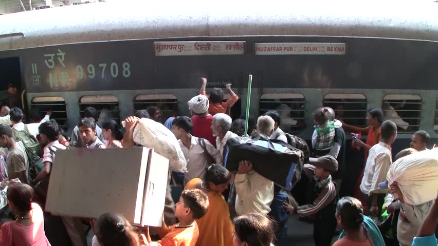 DELHI - NOV 13: People waiting for their trains in the Delhi Junction Railway Station on November 13, 2011 in Delhi, India. Delhi Junction is the oldest railway station of Delhi city.