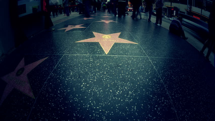LOS ANGELES, CA - APRIL 23: (Timelapse View) POV walking on Hollywood Walk of Fame stars on April 23, 2012 in Los Angeles. Hollywood Walk of Fame is an international tourist attraction in LA.