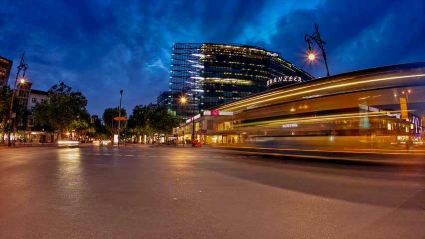 BERLIN, GERMANY, CIRCA 2011: (Time lapse view) Cars drive past famous avenue in Berlin Kudamm during sunset circa 2011 in Berlin, Germany.