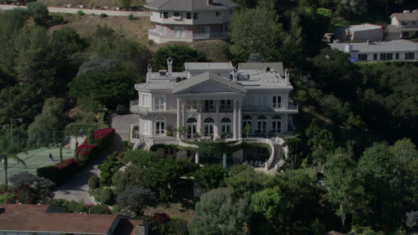 aerial view of a gorgeous white colonial-style mansion circa 2009