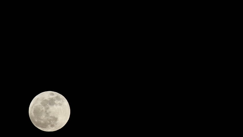 Full Supermoon passes fast time lapse across black night sky. Historic large moon in May 2012. Detail of landscape, craters and plains. Solar system closest body to earth. Fast time lapse.