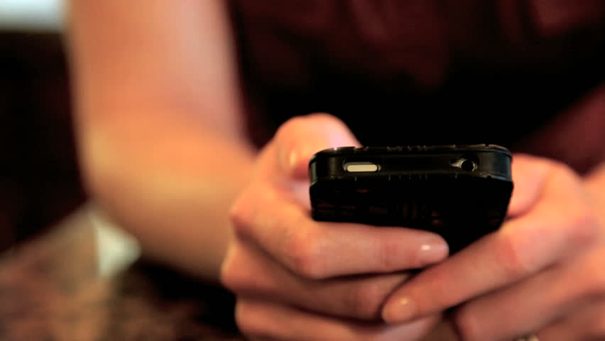 close up of woman using her phone