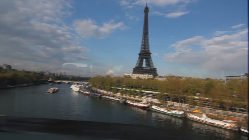 Eiffel Tower from Metro train.
View of the Eiffel Tower and the Seine shot through the window of a metro train. Paris, France.
