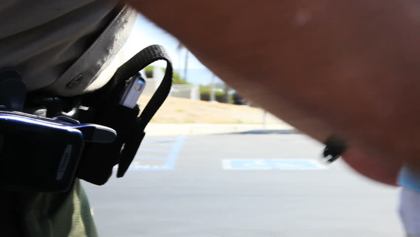 Police officer hand cuffing a suspect