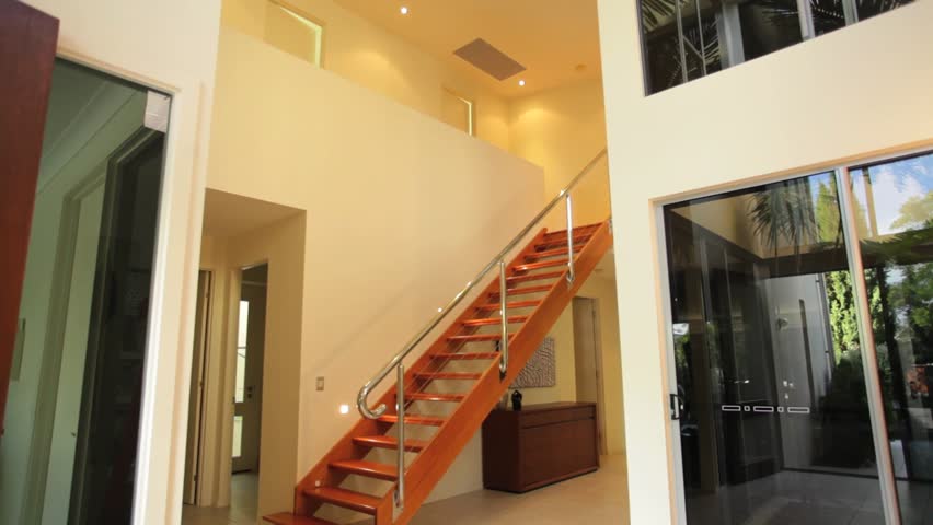 Luxurious, stylish Australian home, shot on a sliding dolly. Sequence. 