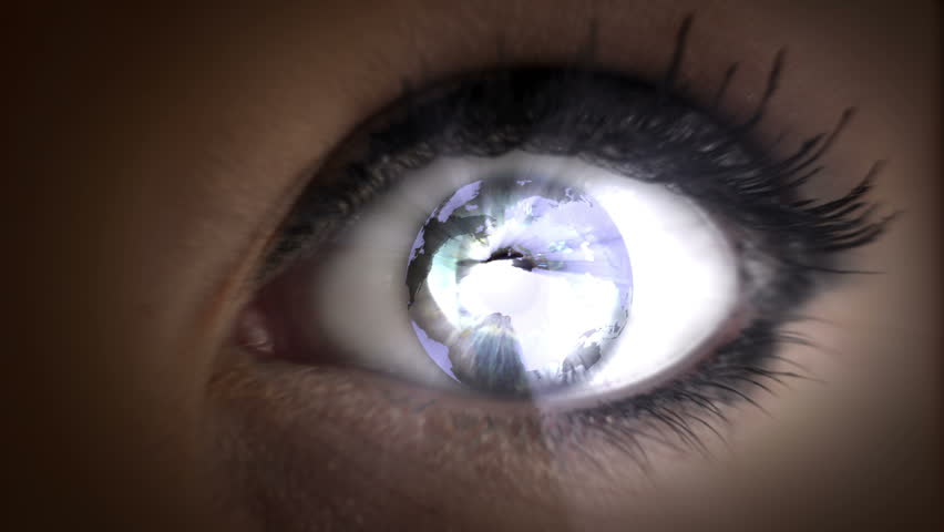 Looping video direct close up shot of a woman with graphical earth rotating in her eyes.