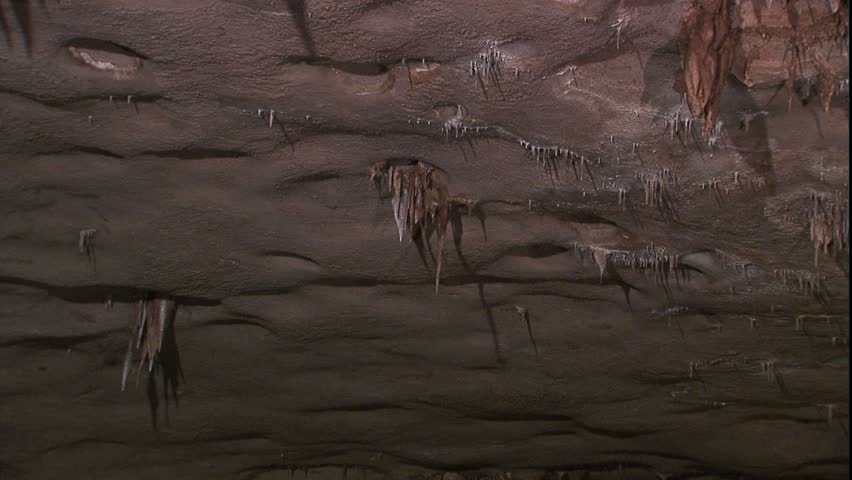 Pan cave roof with man small stalactites
