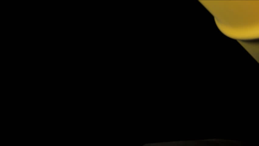 Oil pours out of yellow barrel
