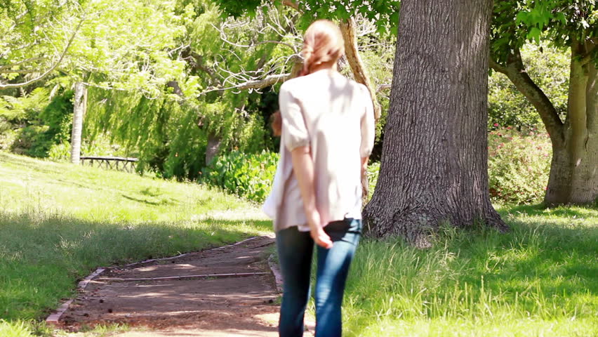 Woman walking in a park alone