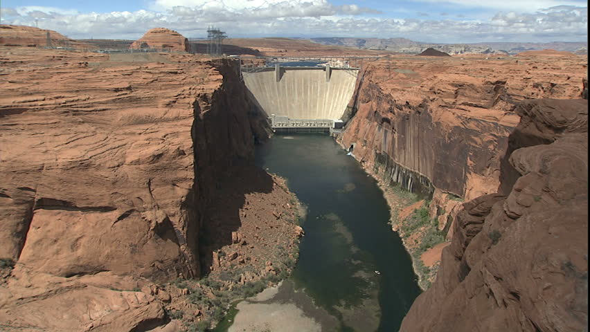 glen canyon dam and lake Powell in distance, zoom down to third location where anglers are parked for fly fishing on the Colorado river in glen canyon