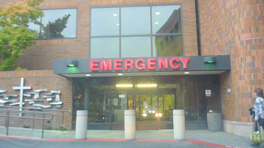 PORTLAND, OREGON - CIRCA MARCH 2012: Car driving point of view heading to emergency room at hospital.