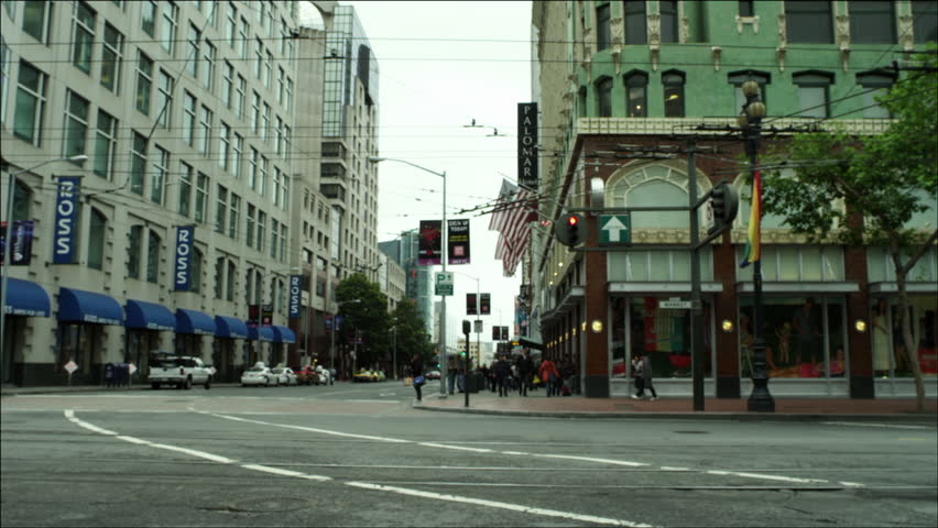 SAN FRANCISCO - CIRCA OCTOBER 2011: Muni busses cross Market Street and turn down 4th Street circa October 2011 in San Francisco, CA.