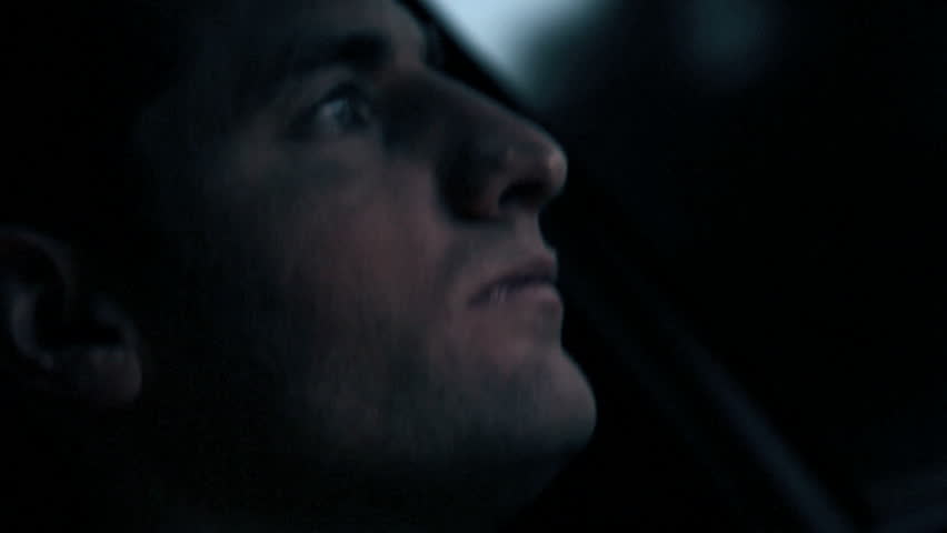 Close up of a man getting tired while driving
