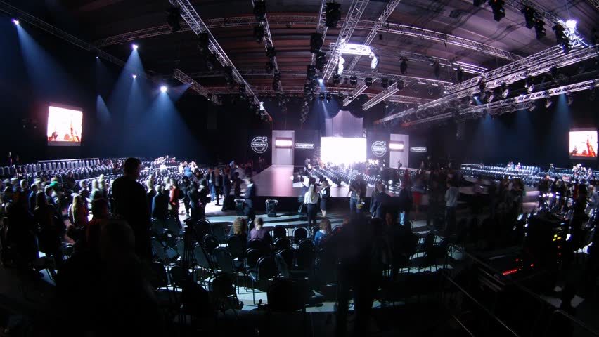 MOSCOW - APR 8: (Timelapse View) Visitors walk near podium on VOLVO - Week of fashion in Moscow in Gostini dvor, on April 8, 2012 in Moscow, Russia