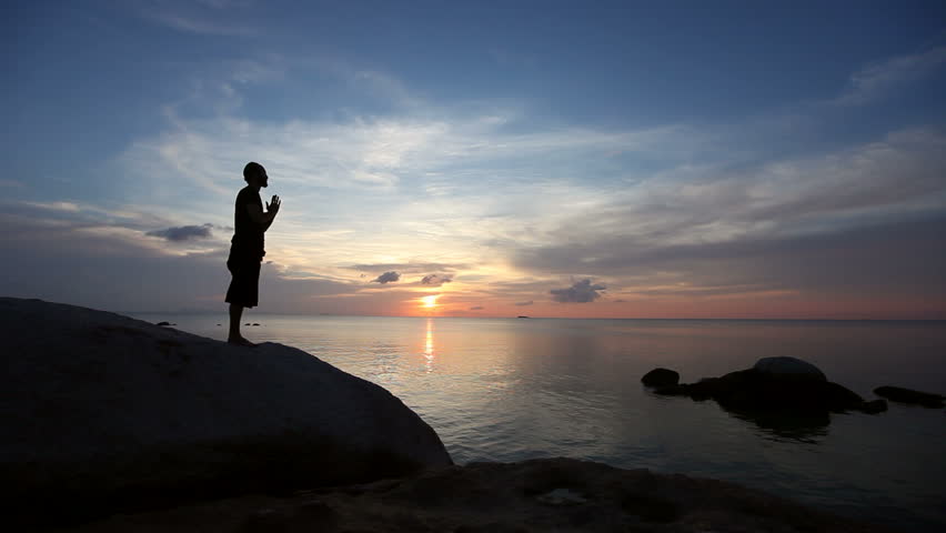 Man Performing Hatha Yoga By The Sea