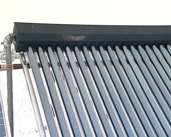 solar collectors on roof of private house in winter. renewable electricity generation.