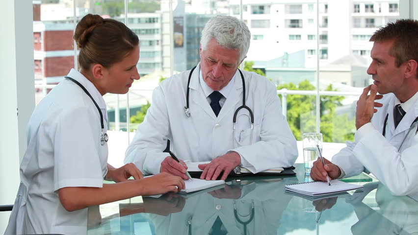 Medical staff in meeting in a bright office
