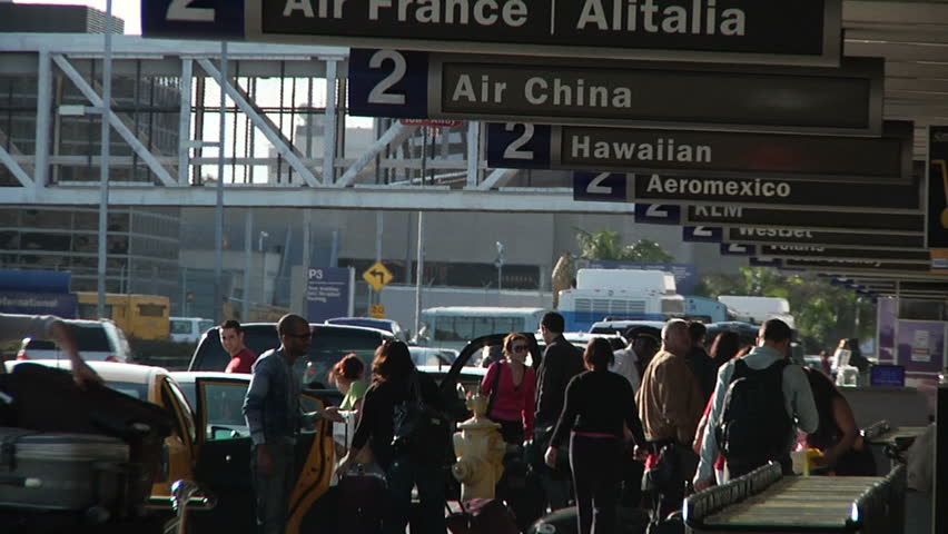 LOS ANGELES - CIRCA 2012: Unknown travelers at LAX airport during busy travel weekend circa 2012 in Los Angeles, CA.