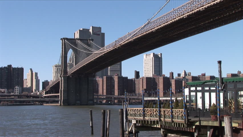 View of Brooklyn Bridge from across the river in New York United States