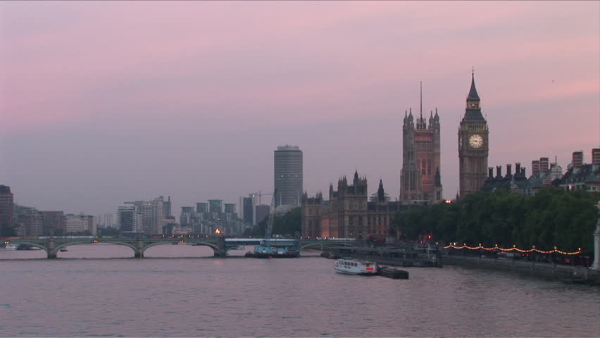 Westminster Bridge in Thames River London United Kingdom at dusk