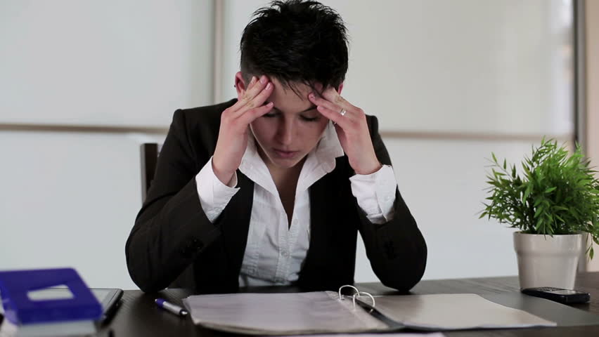Overworked, tired and stressed punk businesswoman in the office
