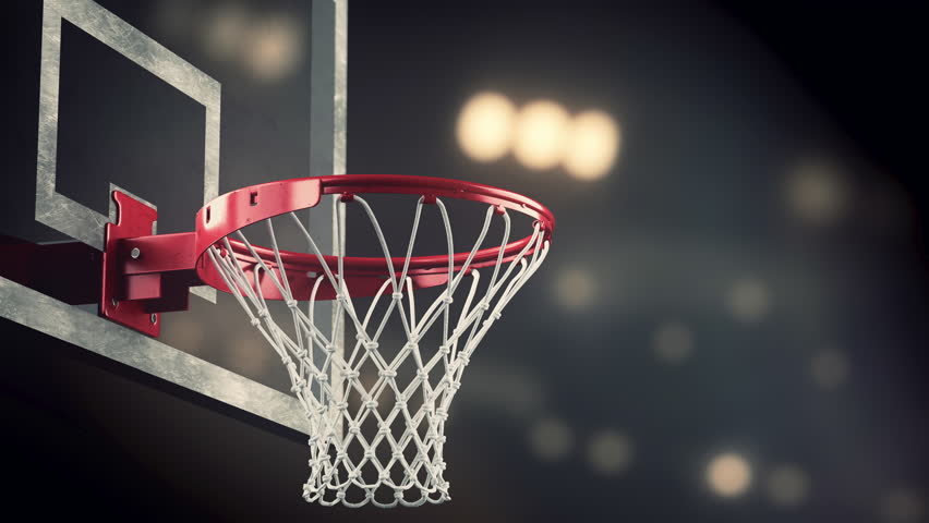 Ball Fly Into The Basket At Basketball Court Against Spectators Stock