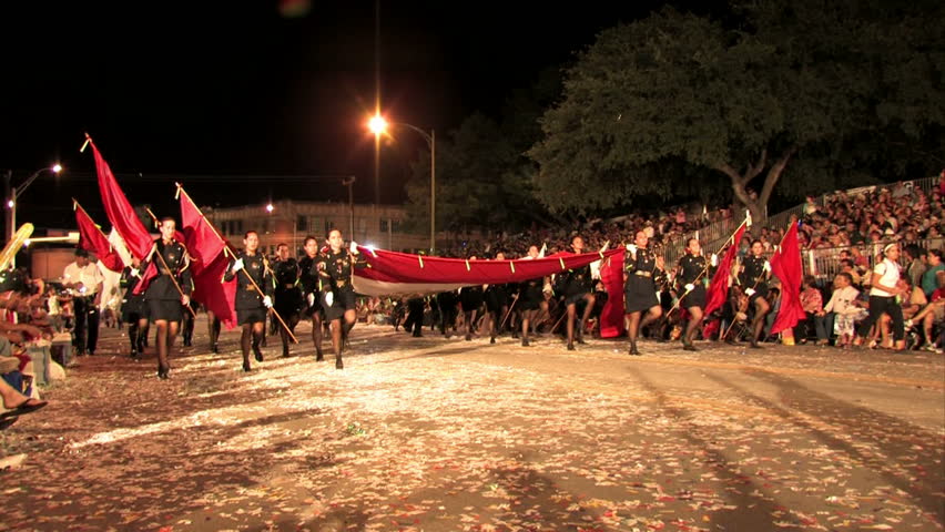 SAN ANTONIO, TEXAS APR 2008: Economic boost to economy night time Flambeau Parade through San Antonio. Participants throughout the country. High School marching band from Mexico shows patriotism.