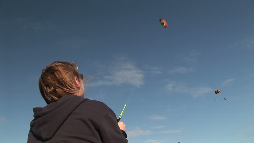 Woman (37 yr) flying a stunt kite at the Long Beach International Kite Festival, Washington.	 Format: NTSC HDV Compression: MotionJPEG-A Camera: Sony HVR-Z1U Size: 1080i (1920 x 1080) Sound: No