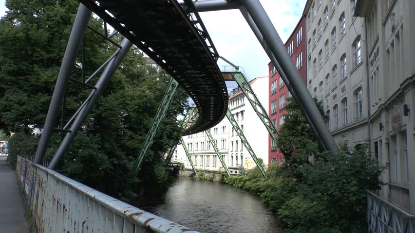 WUPPERTAL, GERMANY - JUNE 17: The Schwebebahn floating tram goes past on June 17, 2012 in Wuppertal, Germany.