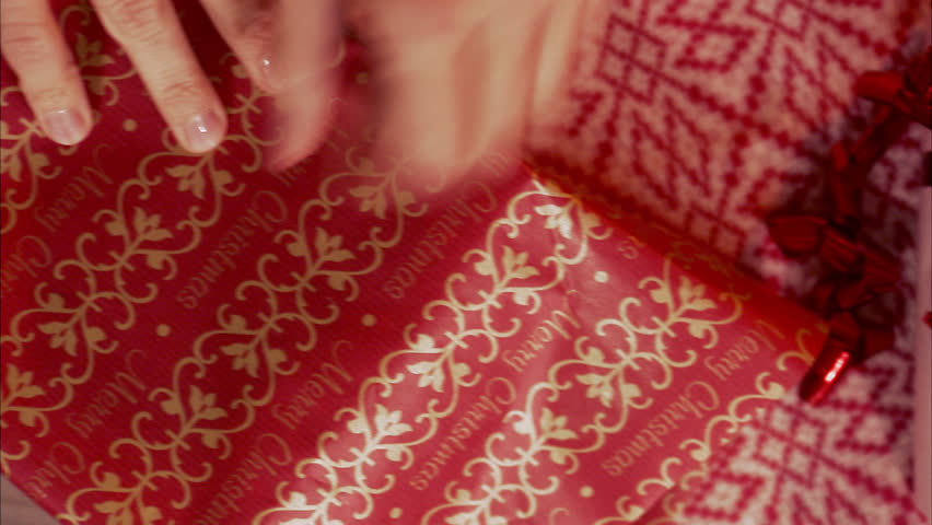Woman wrapping a Christmas gift