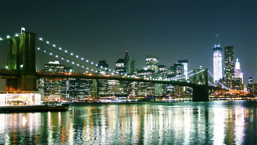Beautiful view of Manhattan skyline and Brooklyn bridge at night. Time lapse and loopable. high quality footage - original size 4k (4096x2304)
